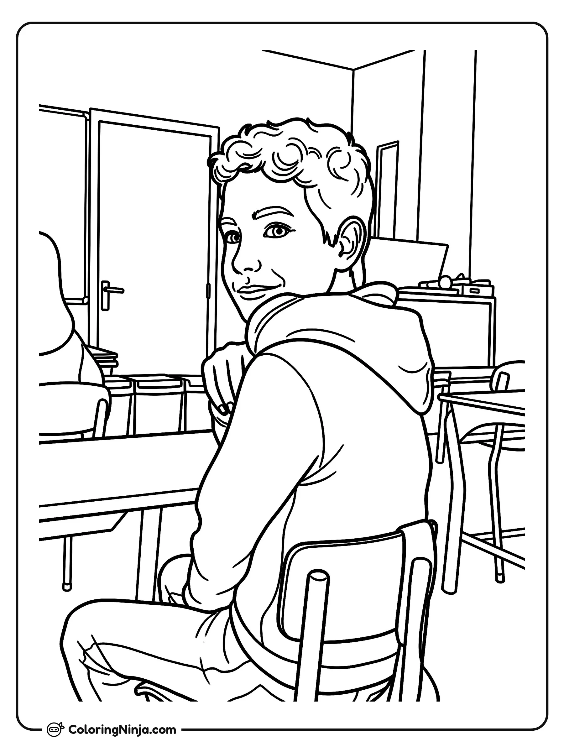 Niño sonriendo en su escritorio de clases, dibujo para colorear: Un niño con sudadera con capucha está sentado en su escritorio en el salón de clases y se gira con una sonrisa. Al fondo se ven otras mesas, sillas, una puerta y un pizarrón.