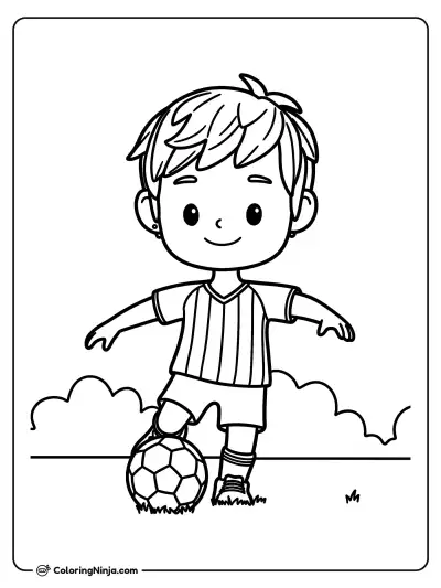 Niño jugando fútbol en el campo