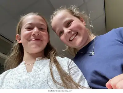 A coloring page of Two Smiling Girls Looking Down